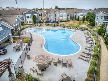 Resort-style swimming pool with cabanas